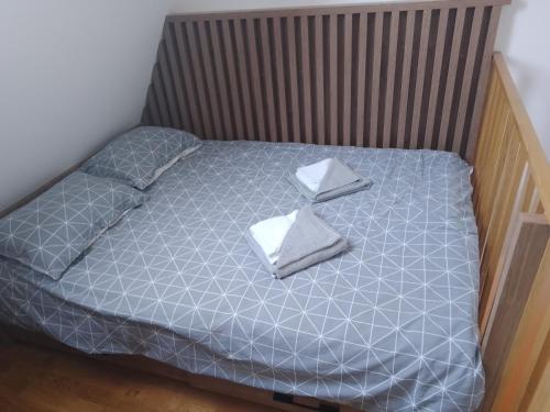 Postel nebo postele na pokoji v ubytování Apartman Pahuljica Divčigora