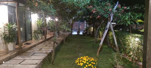 a garden with plants and flowers in a house at Bebe Homestay Phu Quoc in Phu Quoc