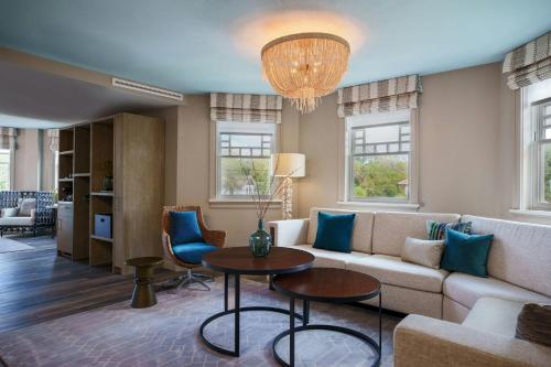 a living room with a couch and a table at Renaissance St. Augustine Historic Downtown Hotel in Saint Augustine