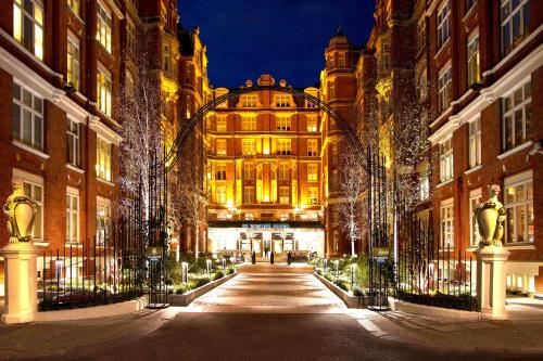 a building with an archway in a city at night at St. Ermin's Hotel, Autograph Collection in London