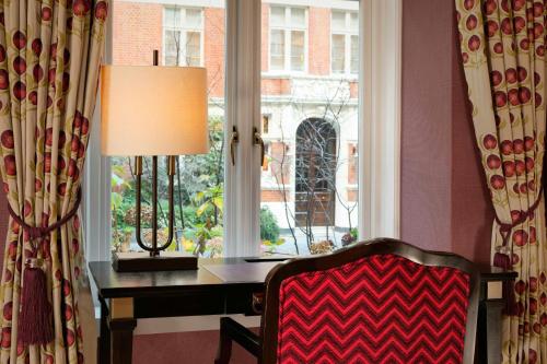a room with a desk in front of a window at St. Ermin's Hotel, Autograph Collection in London