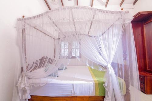 Ένα ή περισσότερα κρεβάτια σε δωμάτιο στο Holiday Penthouse Galle