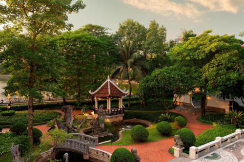 a garden with a gazebo and a bridge at Sheraton Hanoi Hotel in Hanoi