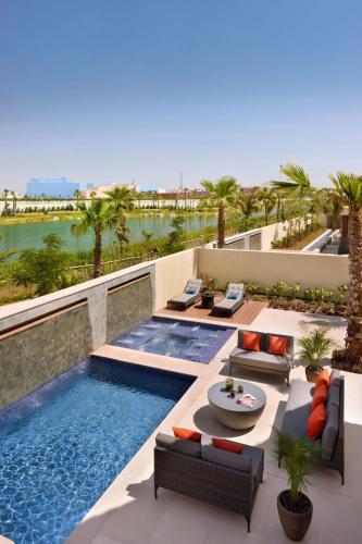 a swimming pool on the roof of a house at Lapita, Dubai Parks and Resorts, Autograph Collection in Dubai