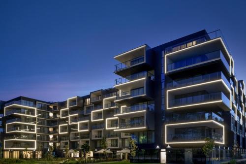 an image of an apartment building at night at AC Hotel by Marriott Krakow in Kraków