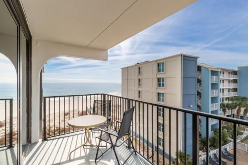 a balcony with a table and a view of the ocean at Island Sunrise 469 in Gulf Shores