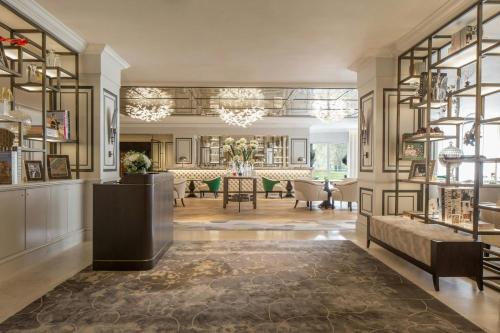 a living room with a couch and a table at JW Marriott Grosvenor House London in London