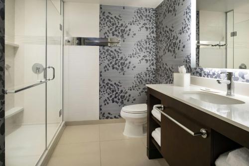 a bathroom with a toilet and a sink and a shower at Residence Inn by Marriott Los Angeles Pasadena/Old Town in Pasadena
