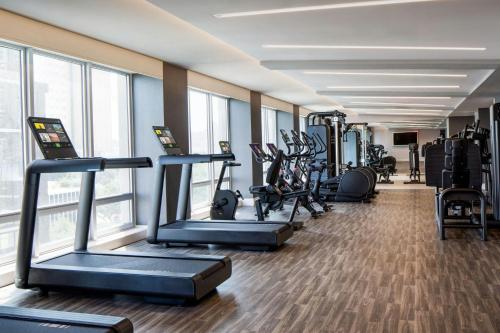 a gym with treadmills and elliptical machines at Le Meridien Fort Worth Downtown in Fort Worth