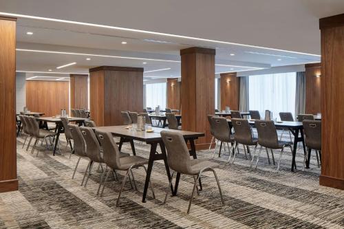 a conference room with tables and chairs in it at Le Meridien Fort Worth Downtown in Fort Worth