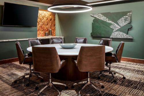 a conference room with a table and chairs at Le Meridien Fort Worth Downtown in Fort Worth