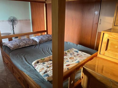 Postel nebo postele na pokoji v ubytování Farm cô chú Tuấn Hà