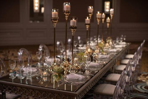a long banquet table with glasses and candles at Renaissance Dallas Addison in Addison