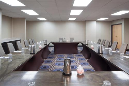 a conference room with a long table and chairs at Sheraton Bucks County Langhorne in Langhorne