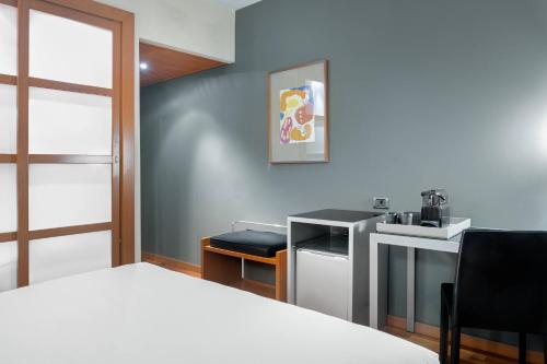 Ένα ή περισσότερα κρεβάτια σε δωμάτιο στο AC Hotel Ponferrada by Marriott