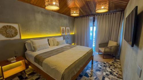 Postel nebo postele na pokoji v ubytování Carnaúba Hotel Boutique