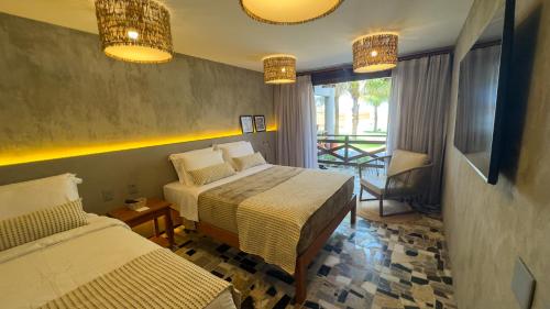 Postel nebo postele na pokoji v ubytování Carnaúba Hotel Boutique