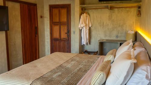 Postel nebo postele na pokoji v ubytování Carnaúba Hotel Boutique