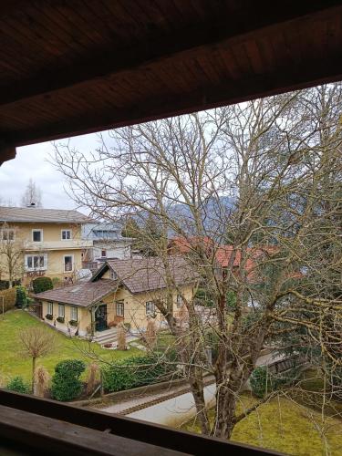 a view of a house from a window at Ferienwohnung am Traunsee in Eck