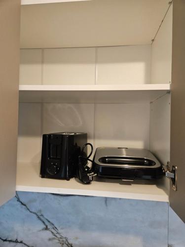 Η κουζίνα ή μικρή κουζίνα στο Gluosnių apartamentai