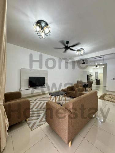 a living room with two couches and a tv at Home Away Homestay in Siliau