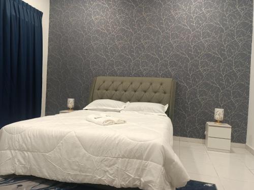 Postel nebo postele na pokoji v ubytování Amza Homestay