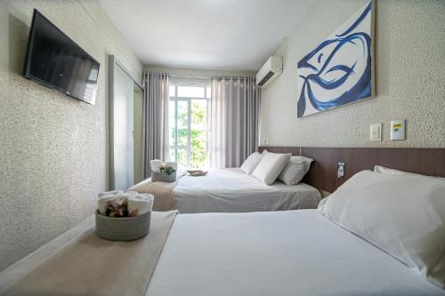 Ένα ή περισσότερα κρεβάτια σε δωμάτιο στο Hotel Rotorua inn Fortaleza - Beira Mar