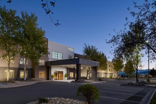 a building with a parking lot in front of it at Fairfield Inn & Suites by Marriott Missoula Airport in Missoula