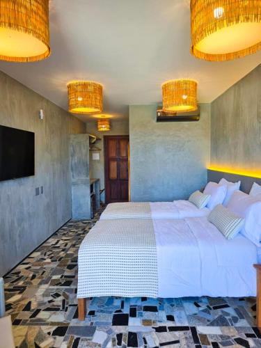 Postel nebo postele na pokoji v ubytování Carnaúba Hotel Boutique