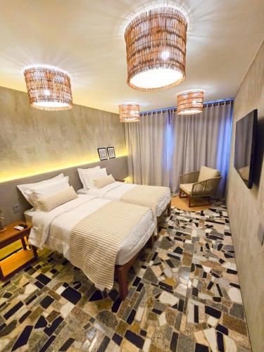 Postel nebo postele na pokoji v ubytování Carnaúba Hotel Boutique