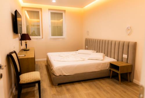 Postel nebo postele na pokoji v ubytování Hotel Univers Laç