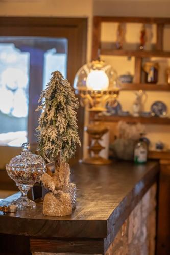a vase with a tree on top of a table at Archontiko Zakoni in Neochori