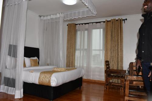 Postel nebo postele na pokoji v ubytování Tawala Garden Hotel