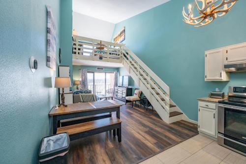 a kitchen and dining room with a staircase in a house at 710H Studio Loft One Bath in Oakland