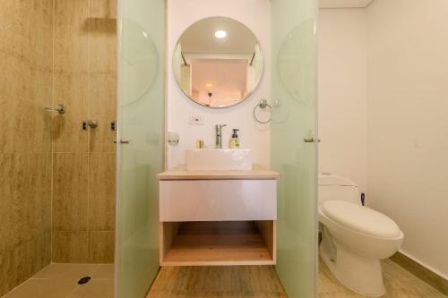 a bathroom with a sink and a toilet at Cartagena Beach Resort 807 in Cartagena de Indias