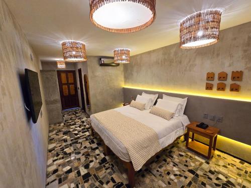 Postel nebo postele na pokoji v ubytování Carnaúba Hotel Boutique