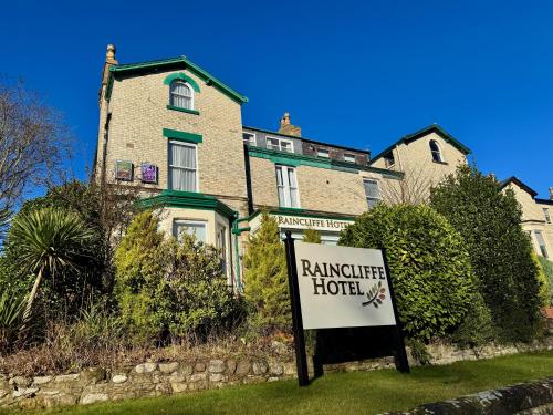 a house with a sign in front of it at The Raincliffe Hotel in Scarborough