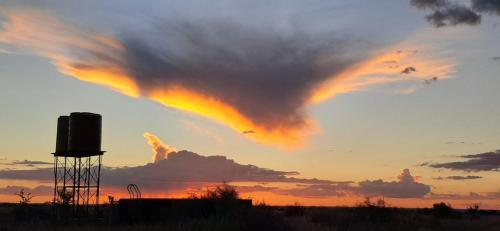 a cloud formation in the sky at sunset at Dopper Joris Bruidswa Adam se Uitspanning in Orania