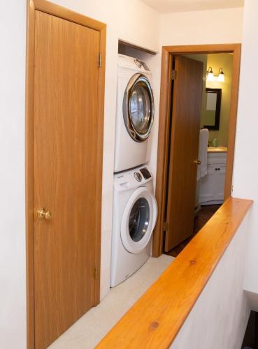 a laundry room with a washer and dryer in it at Eagles Mountain Retreat in Somerset