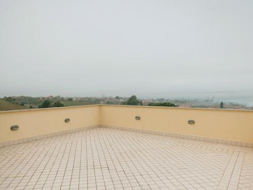 a balcony with a view of the city at Green Hotel Poggio Regillo in Frascati