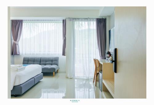 Ένα ή περισσότερα κρεβάτια σε δωμάτιο στο Kamala Havana Hotel