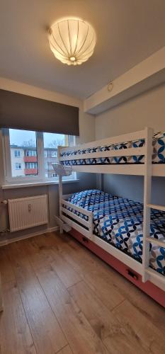 Postel nebo postele na pokoji v ubytování Comfortable Apartment Gerbera Tallinn