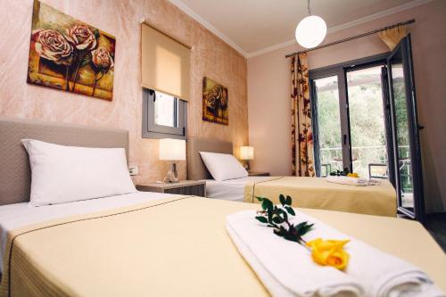 Postel nebo postele na pokoji v ubytování Ionian Diamond Villas