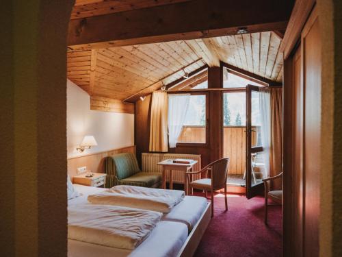 Postel nebo postele na pokoji v ubytování Hotel Zimba