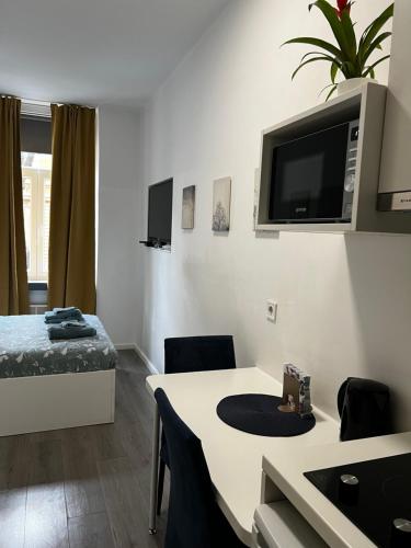 Μια τηλεόραση ή/και κέντρο ψυχαγωγίας στο City center Apartment 6 apartman HEBRANGOVA