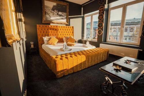 Postel nebo postele na pokoji v ubytování Hôtel Palmarès