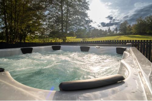 a jacuzzi tub with water in it at Lowwood Lodges in Houston