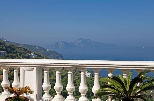 a white balcony with a view of the ocean at Hotel & Spa Bellavista Francischiello in Massa Lubrense