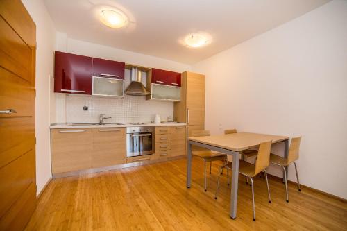 a kitchen with a table and chairs in a room at Villa Tucepi Beach in Tučepi