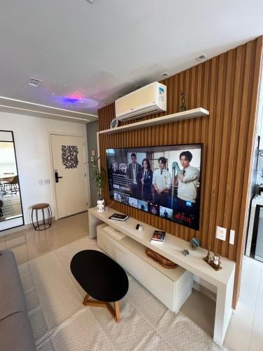 Μια τηλεόραση ή/και κέντρο ψυχαγωγίας στο Sua casa com vistas no Bueno